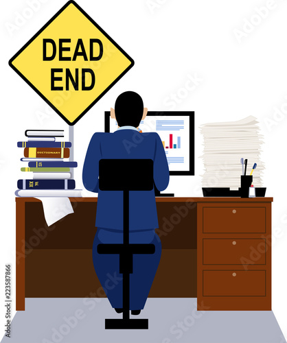 Person Working At The Desk With A Dead End Sign Above It As A