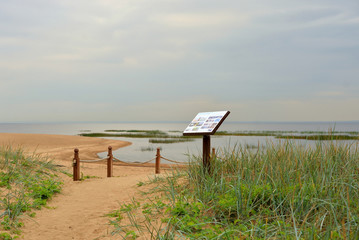 Wall Mural - Coast of sea at cloud day.