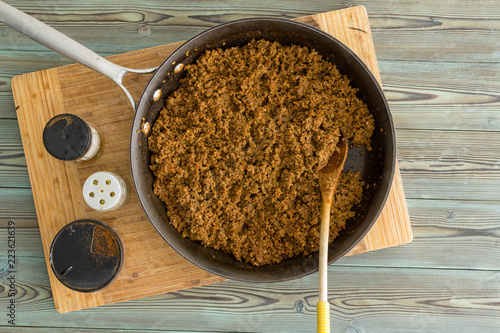 Fotografie, Obraz Old frying pan filled with cooked ground beef