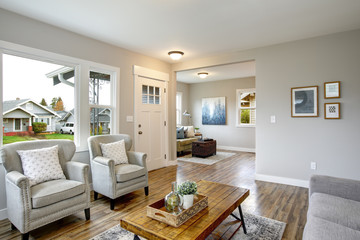 spacious living room with light gray walls