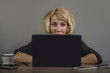 © TheVisualsYouNeed - lifestyle portrait of young stressed and messy business woman working at office laptop computer desk feeling tired and overwhelmed looking desperate and helpless