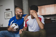 © ReeldealHD images - Male friends watching a football match