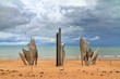 Beautiful view of WWII monument Les Braves, on the center of Omaha Beach in Normandy, France, with clouds in summer
