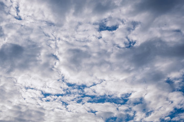 White clouds on a blue sky in clear weather.