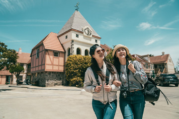 Wall Mural - women sightseeing and walking cheerfully