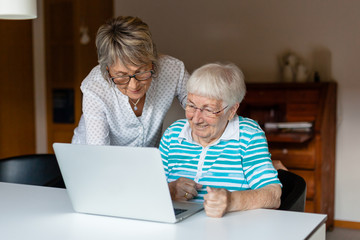 Very old senior woman learning to use a computer