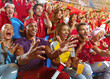 © Alex - Young sport supporter happy fans cheering at stadium. Group of young woman and man support the football team during the match