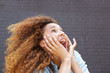 © mimagephotos - Close up young woman with surprised face expression and looking up