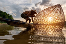 Fishermen Fishing In The Early Morning Golden Light,fisherman Fishing In Mekong River ,Thailand,Vietnam,myanmar,Laos