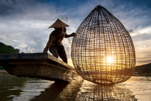 Fishermen Fishing In The Early Morning Golden Light,fisherman Fishing In Mekong River ,Thailand,Vietnam,myanmar,Laos