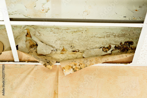 Water Leak On The Ceiling Tiles From The Damaged Roof Brown Stain