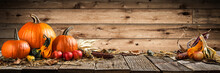 Thanksgiving With Pumpkins Corncob And Apples On Wooden Table