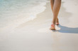 © Peera - Travel woman foot on beach