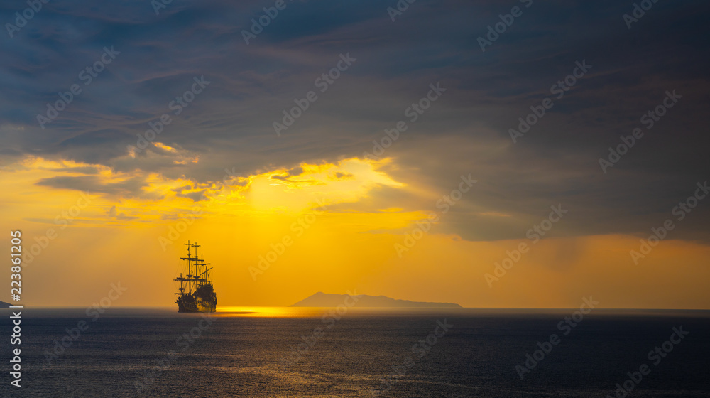 Pirate ship at the open sea at the sunset Stock Photo | Adobe Stock