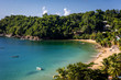 Beautiful tropical beach in Trinidad and Tobago, Caribe - blue sky, trees, sand beach, wood boats