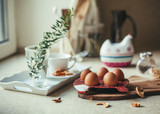 Fototapeta Kuchnia - Morning composition with eggs, breadcrumbs and coffee