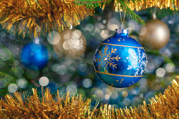 Christmas-tree decoration bauble on decorated Christmas tree bac