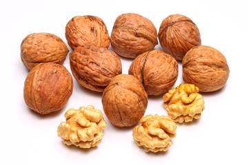 Poster - Walnuts and kernels on a white background