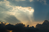 Fototapeta Na drzwi - Sun rays through clouds like an dramatic explosion , power nature background.