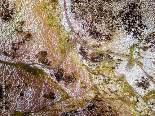 Fotografia, Obraz Colourful Aerial view looking down on a mountain range topography in the UK