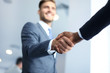 © ty - Business people shaking hands, finishing up a meeting.