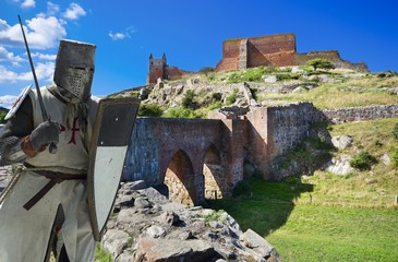 Wall Mural - Medieval knight and ruins of Hammershus castle - the biggest Northern Europe castle ruins situated at steep granite cliff on the Baltic Sea coast, Bornholm, Denmark