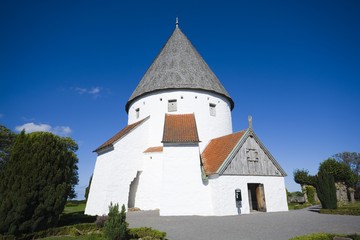 Wall Mural - Defensive round church in Olsker, Bornholm, Denmark. It is one of four round churches on the Bornholm island. Built about 1150, 26 meter high, considered the most elegant round church