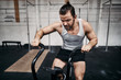 © Flamingo Images - Fit young man working out on a gym stationary bike