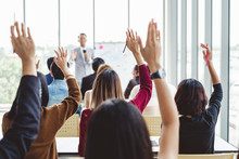 Group Of Business People Raise Hands Up To Agree With Speaker In The Meeting Room Seminar