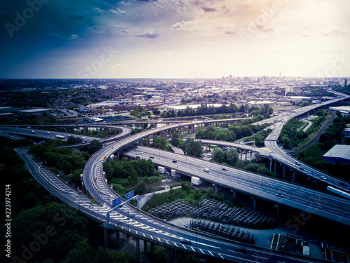 Cuadros en Lienzo Aerial view of a complex motorway road junction with traffic moving