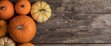 Pumpkins On Wooden Background
