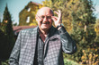 © T.Den_Team - Mature European or American man with a good mood, outdoor portrait. The concept of life after 50-60 years. Positive emotions in senior life. Inspirations in everyday life