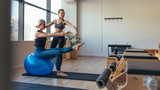 Woman doing pilates training at the gym