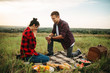 Man makes a marriage proposal on romantic picnic