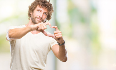 Sticker - Handsome hispanic model man over isolated background smiling in love showing heart symbol and shape with hands. Romantic concept.