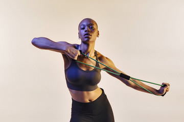 Woman stretching resistance band