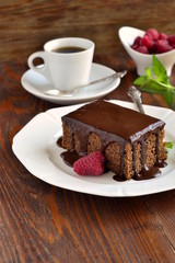 Poster - Slice of chocolate cake with glaze and raspberries,  vertical