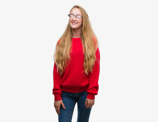 Canvas Print - Blonde teenager woman wearing red sweater with a happy and cool smile on face. Lucky person.