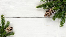 Christmas Fir Tree Branches With Pine Cones Background