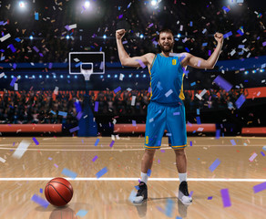 basketball player im blue uniform standing on basketball court