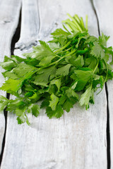 Poster - celery leafs on wooden surface