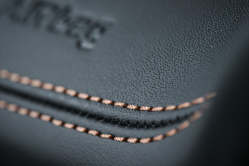 Wall Mural - Detailed image of a dashboard airbag zone leather stitch work.