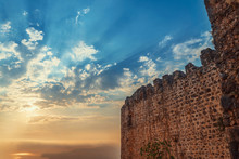 Fortress Wall On Mountain View Of Sunset On Sea