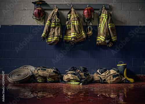 Fotografie, Obraz Firefighter bunker suit in the fire station