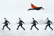 © Who is Danny - Businesswoman flying over businessmen