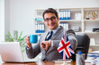 © Elnur - Businessman with British flag in the office