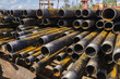 Drilling of oil and gas wells. Drill pipe inspection. Tubing for oil and gas listed on the pedestal out of the wells after washing and ready for inspection. Stack of casing laying on the deck