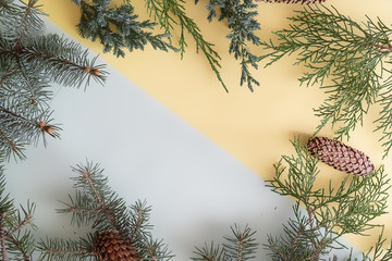 new year mixed color creative background with pine wood, cones and decoration toys and balls copy space f