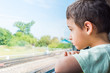 © Mariia Nazarova - boy rides the train and looks out the window