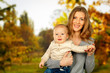 © fotofabrika - Mother hugging her child during walk in the park